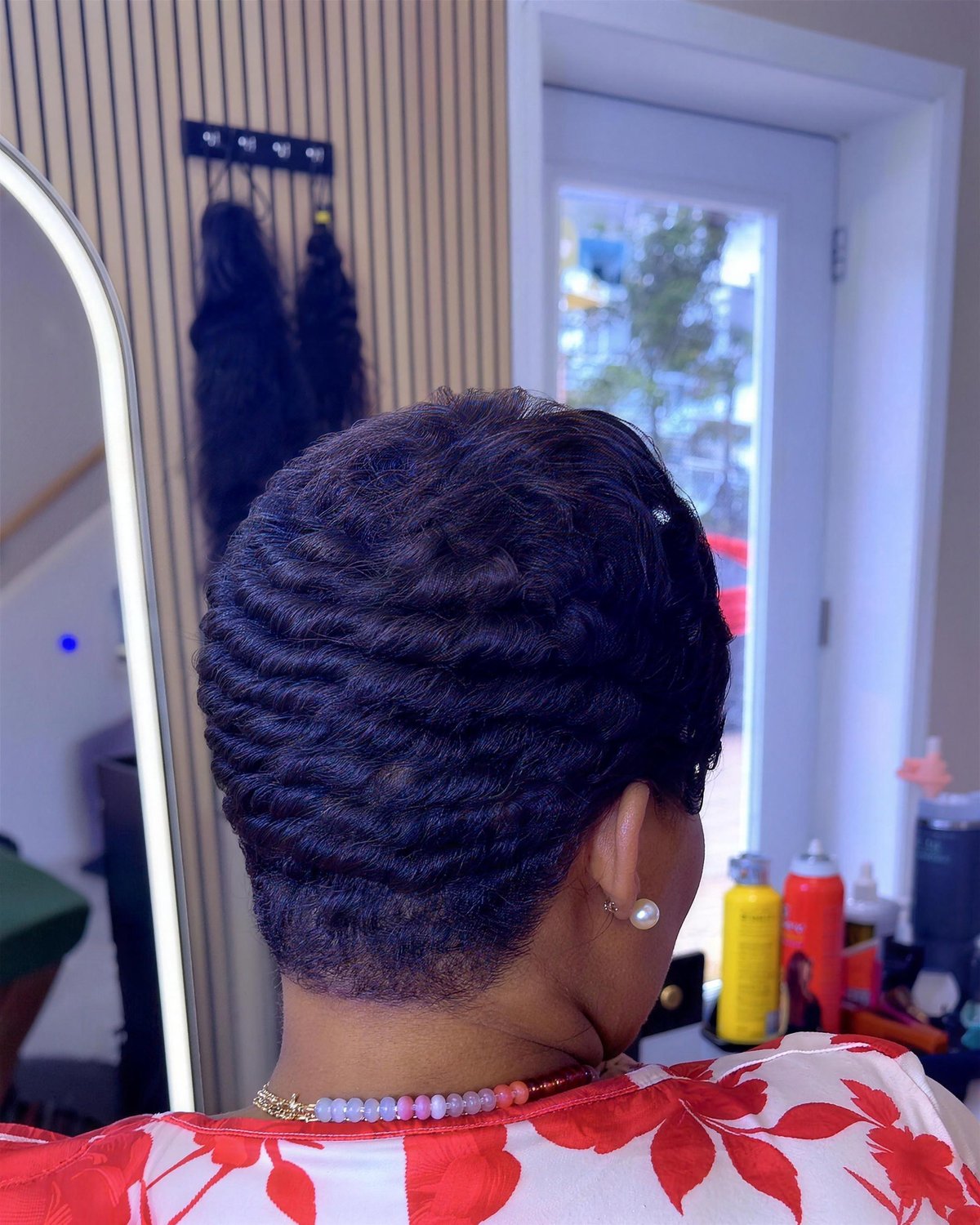 Pixie cut with waves on natural hair.
